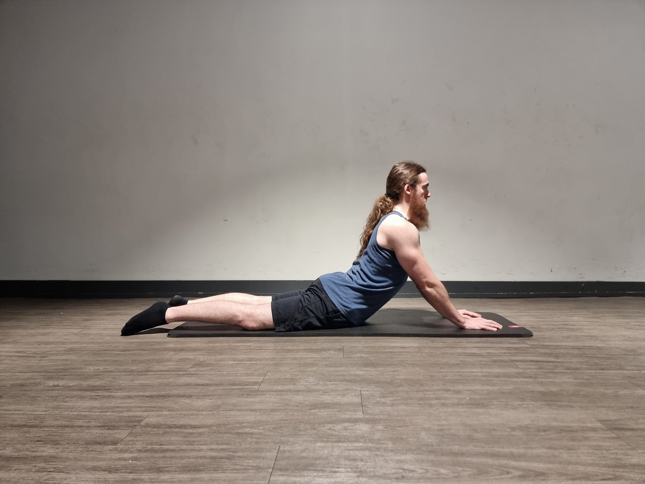 A man performing a prone spinal extension stretch